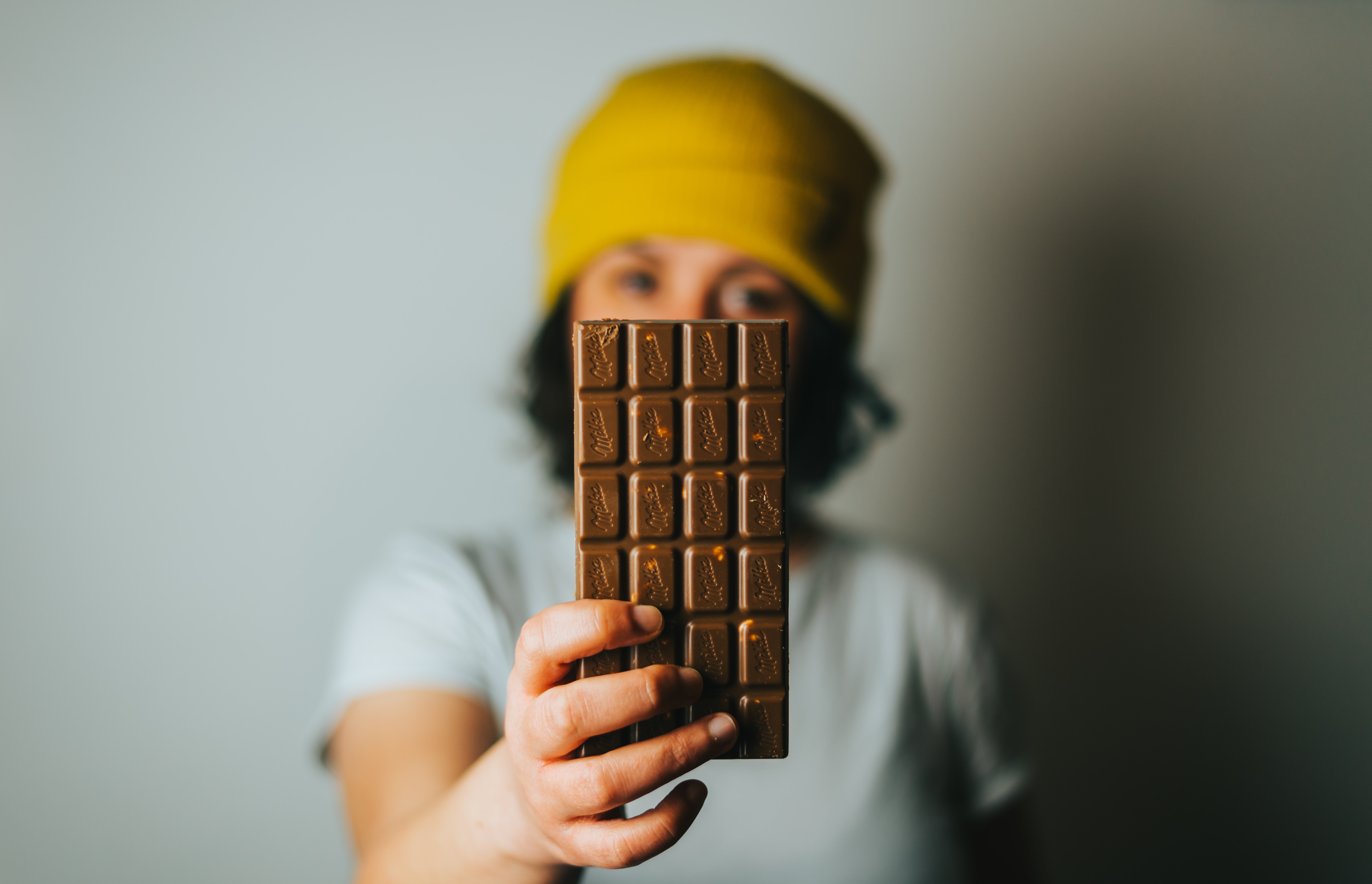 Person holding chocolate bar